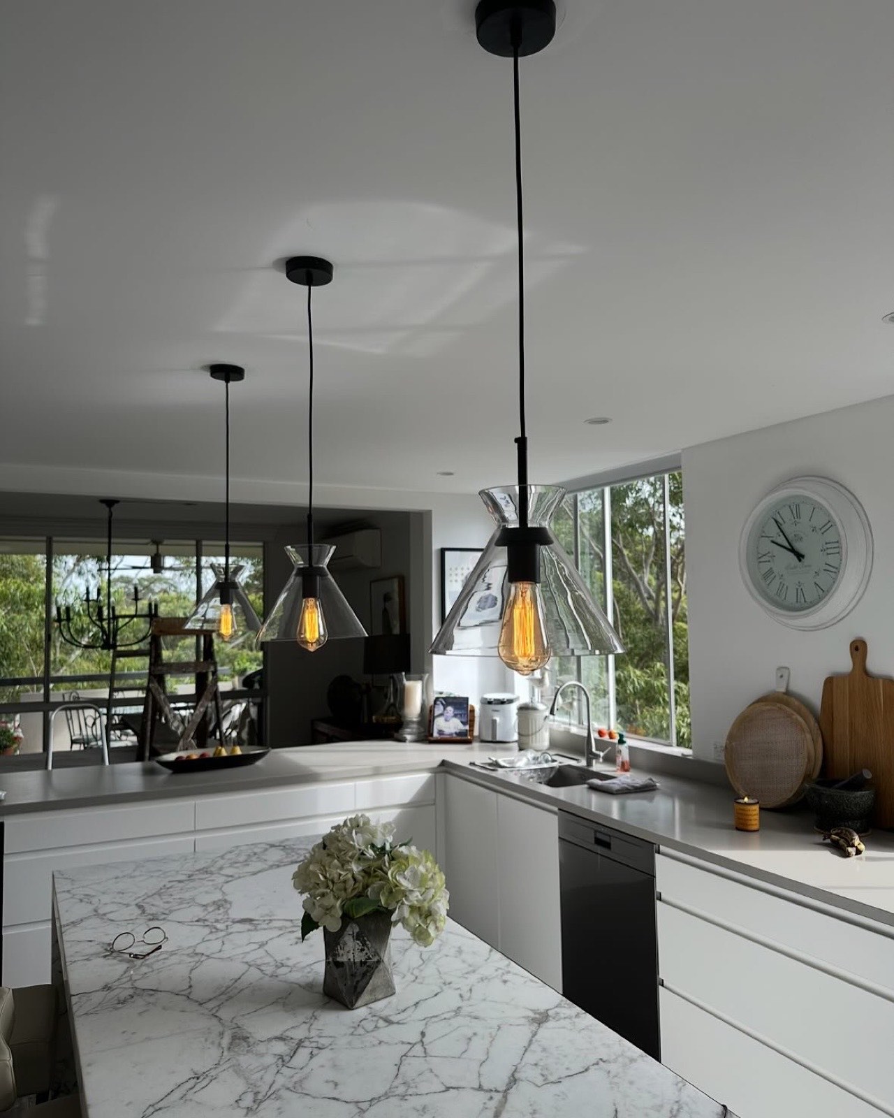 Pendant lights installed over a kitchen island bench