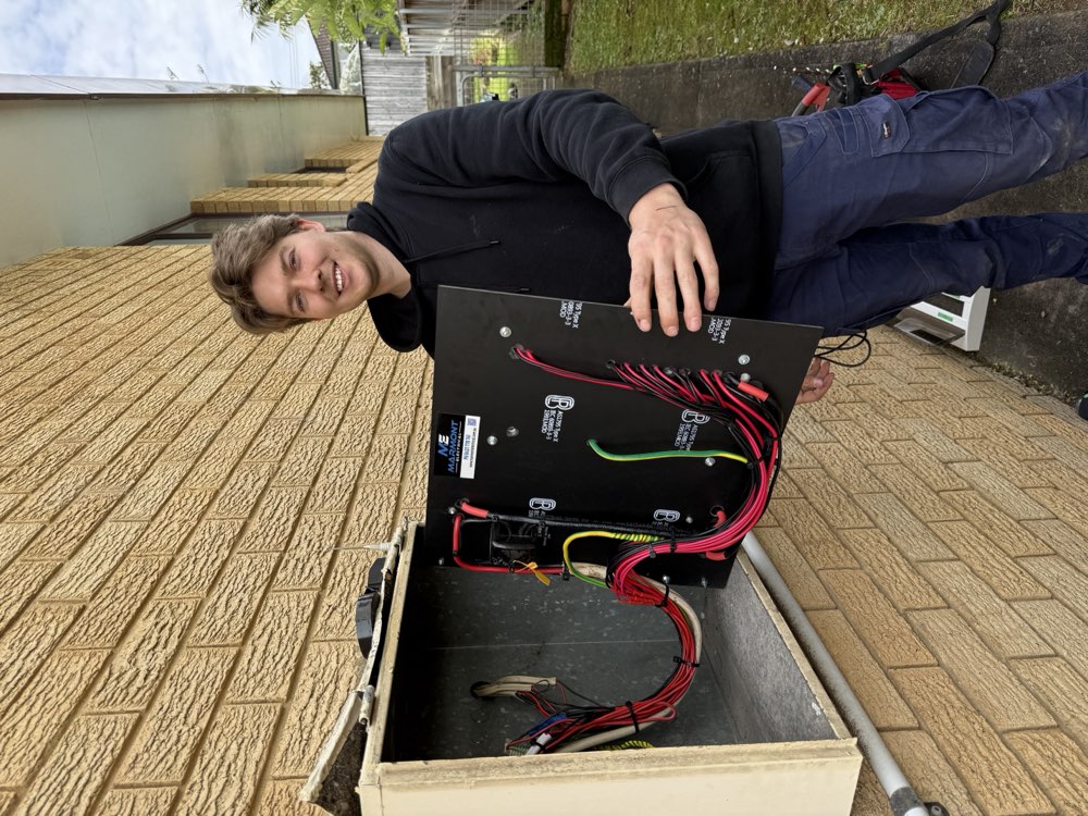 Bryce from Marmont Electrical with a pre-built switchboard panel ready for installation