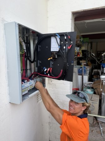 Kane from Marmont Electrical wiring a new switchboard on the Northern Beaches